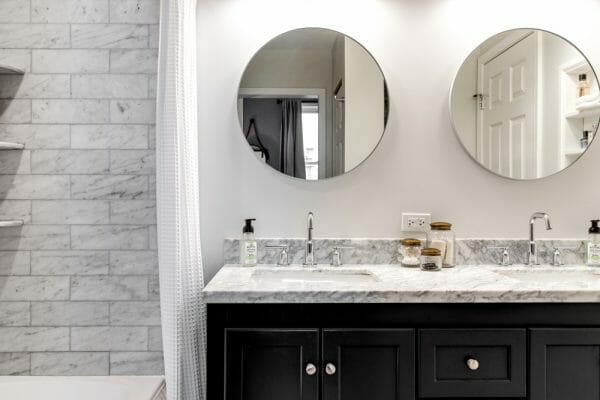 Two bathroom vanities above his and her sinks